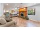 An expansive living space with tiled floors, a fireplace, and views into the kitchen and backyard at 5312 Manuel Dr, Las Vegas, NV 89149