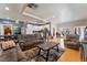 Open-concept living area with a modern kitchen, comfortable seating, and hardwood floors at 5312 Manuel Dr, Las Vegas, NV 89149