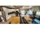 Spacious living room includes a kitchen and stainless steel appliances at 5312 Manuel Dr, Las Vegas, NV 89149