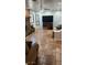 Open living room with tile flooring, ceiling fan, and fireplace at 5312 Manuel Dr, Las Vegas, NV 89149