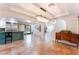 Open-concept living space with tile floors, turquoise kitchen island, and decorative lighting at 5312 Manuel Dr, Las Vegas, NV 89149