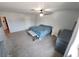 Spacious main bedroom with soft carpet, ceiling fan, and ample natural light at 5312 Manuel Dr, Las Vegas, NV 89149