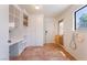 Mudroom includes built-in storage, tile flooring, sink and exterior door at 5312 Manuel Dr, Las Vegas, NV 89149
