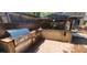 Well-equipped outdoor kitchen area featuring a grill, counter space, and adjacent gazebo at 5312 Manuel Dr, Las Vegas, NV 89149