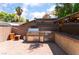 Outdoor kitchen features stainless steel appliances, storage and countertop space at 5312 Manuel Dr, Las Vegas, NV 89149