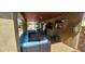 Comfortable covered patio with cozy seating, a TV, and view of the backyard at 5312 Manuel Dr, Las Vegas, NV 89149