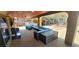 Outdoor patio features lounge seating, grill, and a pool in the backyard at 5312 Manuel Dr, Las Vegas, NV 89149