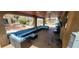 Covered patio with comfortable lounge seating and a television at 5312 Manuel Dr, Las Vegas, NV 89149