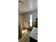 Well-lit shower featuring stone floors and tiled walls at 5312 Manuel Dr, Las Vegas, NV 89149