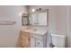 Bathroom featuring a single sink vanity with drawers and a standard toilet at 5620 Pinecone Pl, Las Vegas, NV 89108