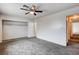 Bedroom features plush carpeting, a built-in closet, and neutral walls at 5620 Pinecone Pl, Las Vegas, NV 89108