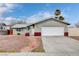 Charming single-story home with a well-maintained front yard and attached two-car garage at 5620 Pinecone Pl, Las Vegas, NV 89108