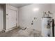 Utility room corner of garage with water heater and plumbing at 5620 Pinecone Pl, Las Vegas, NV 89108