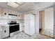 The kitchen offers ample cabinet space, practical appliances, and tile flooring at 5620 Pinecone Pl, Las Vegas, NV 89108