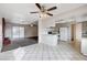 Open-concept kitchen flowing into a living area with a fireplace feature at 5620 Pinecone Pl, Las Vegas, NV 89108