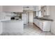 Functional kitchen with ample cabinet space, tile flooring, and practical appliances at 5620 Pinecone Pl, Las Vegas, NV 89108