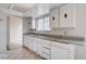 Functional kitchen with ample cabinet space and tile flooring provides a practical cooking space at 5620 Pinecone Pl, Las Vegas, NV 89108