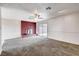 Bright living room with brick fireplace and sliding doors to the backyard at 5620 Pinecone Pl, Las Vegas, NV 89108