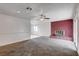 Spacious living area with a brick fireplace and views into an adjacent room at 5620 Pinecone Pl, Las Vegas, NV 89108