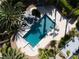 Aerial view of a modern geometric pool, rock feature and sports court in a tropical backyard at 5860 N Campbell Rd, Las Vegas, NV 89149