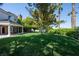 Expansive backyard with lush green lawn and mature trees at 5860 N Campbell Rd, Las Vegas, NV 89149