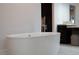 Elegant bathroom featuring a large soaking tub with contemporary fixtures at 5860 N Campbell Rd, Las Vegas, NV 89149