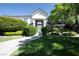 Charming home with a well-maintained lawn, mature landscaping, and a welcoming entrance at 5860 N Campbell Rd, Las Vegas, NV 89149
