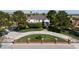 Elegant two-story home with mature trees, circular driveway, and manicured front lawn at 5860 N Campbell Rd, Las Vegas, NV 89149