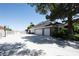 Three-car garage with basketball hoop and expansive driveway at 5860 N Campbell Rd, Las Vegas, NV 89149