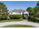 Grand two-story home with mature landscaping, brick accents, and a circular driveway at 5860 N Campbell Rd, Las Vegas, NV 89149