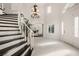 Elegant foyer with chandelier and staircase at 5860 N Campbell Rd, Las Vegas, NV 89149
