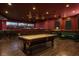 Large game room with a billiards table, lounge area, and custom bar at 5860 N Campbell Rd, Las Vegas, NV 89149