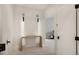 Bright hallway with a wooden table, marble floors, and neutral decor at 5860 N Campbell Rd, Las Vegas, NV 89149