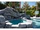 A custom rock waterfall feature adds an element of elegance to this pool and hot tub at 5860 N Campbell Rd, Las Vegas, NV 89149