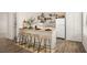 Stylish kitchen counter with seating, modern appliances and shelving detail at 5860 N Campbell Rd, Las Vegas, NV 89149