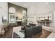 Bright, open-concept living room features a stone fireplace and seamless flow to kitchen at 5860 N Campbell Rd, Las Vegas, NV 89149