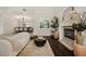 Cozy living room with fireplace, wood floors, and large windows at 5860 N Campbell Rd, Las Vegas, NV 89149