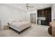 Airy main bedroom featuring a refreshment center, neutral decor, and tiled floors at 5860 N Campbell Rd, Las Vegas, NV 89149