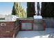 Outdoor kitchen featuring stainless steel appliances, a sink, and a brick surround at 5860 N Campbell Rd, Las Vegas, NV 89149