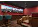 Home theater with tiered seating, custom lighting, and a bar area at 5860 N Campbell Rd, Las Vegas, NV 89149