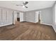 Spacious bedroom featuring carpeted floors, a ceiling fan, and neutral colored paint, perfect for relaxation and comfort at 6053 Lambert Bridge Ave, Las Vegas, NV 89139