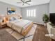Modern bedroom with natural light, ceiling fan, and stylish decor at 6053 Lambert Bridge Ave, Las Vegas, NV 89139