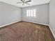 Neutral bedroom featuring carpet, a ceiling fan, and a window, ready for personalization at 6053 Lambert Bridge Ave, Las Vegas, NV 89139