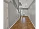 Inviting hallway features a staircase, tile flooring, fresh paint, and ample natural light, creating an open feel at 6053 Lambert Bridge Ave, Las Vegas, NV 89139