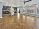 Spacious living room with dark cabinetry, granite countertops, and tile flooring provides an airy space with natural lighting at 6053 Lambert Bridge Ave, Las Vegas, NV 89139
