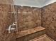 Modern shower featuring a built-in bench and sleek chrome fixtures at 6053 Lambert Bridge Ave, Las Vegas, NV 89139