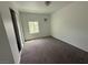 Bedroom with large window providing natural light and a closet with sliding doors at 641 West St, Pahrump, NV 89048