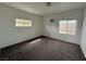 Bright bedroom with two windows providing lots of natural light and carpeted floors at 641 West St, Pahrump, NV 89048