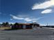 Exterior view showcasing building with vast potential for renovation and new development at 641 West St, Pahrump, NV 89048