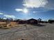 Fenced-in exterior space featuring a building with potential development opportunities at 641 West St, Pahrump, NV 89048